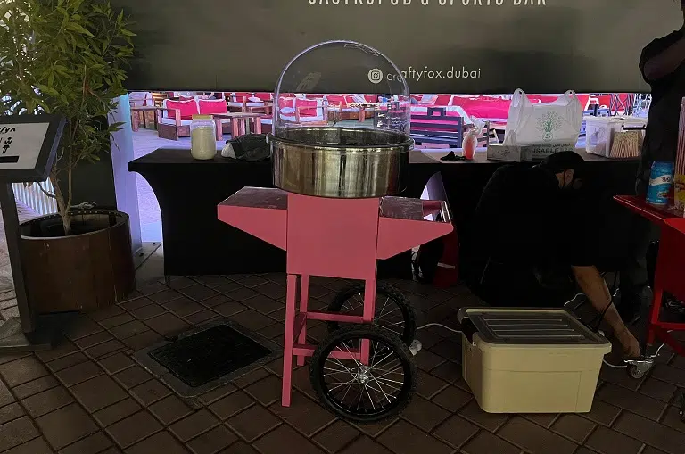 Pink Cotton Candy Machine Cart setup at an outdoor Event in Dubai