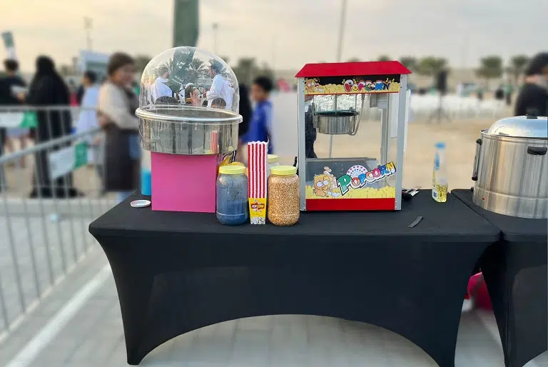 Popcorn and Cotton Candy Machines setup on a table at kids birthday in Dubai